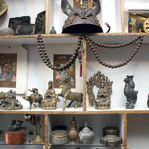Shelves of antiques and traditional crafts in a shop on Chicken Street, Kabul