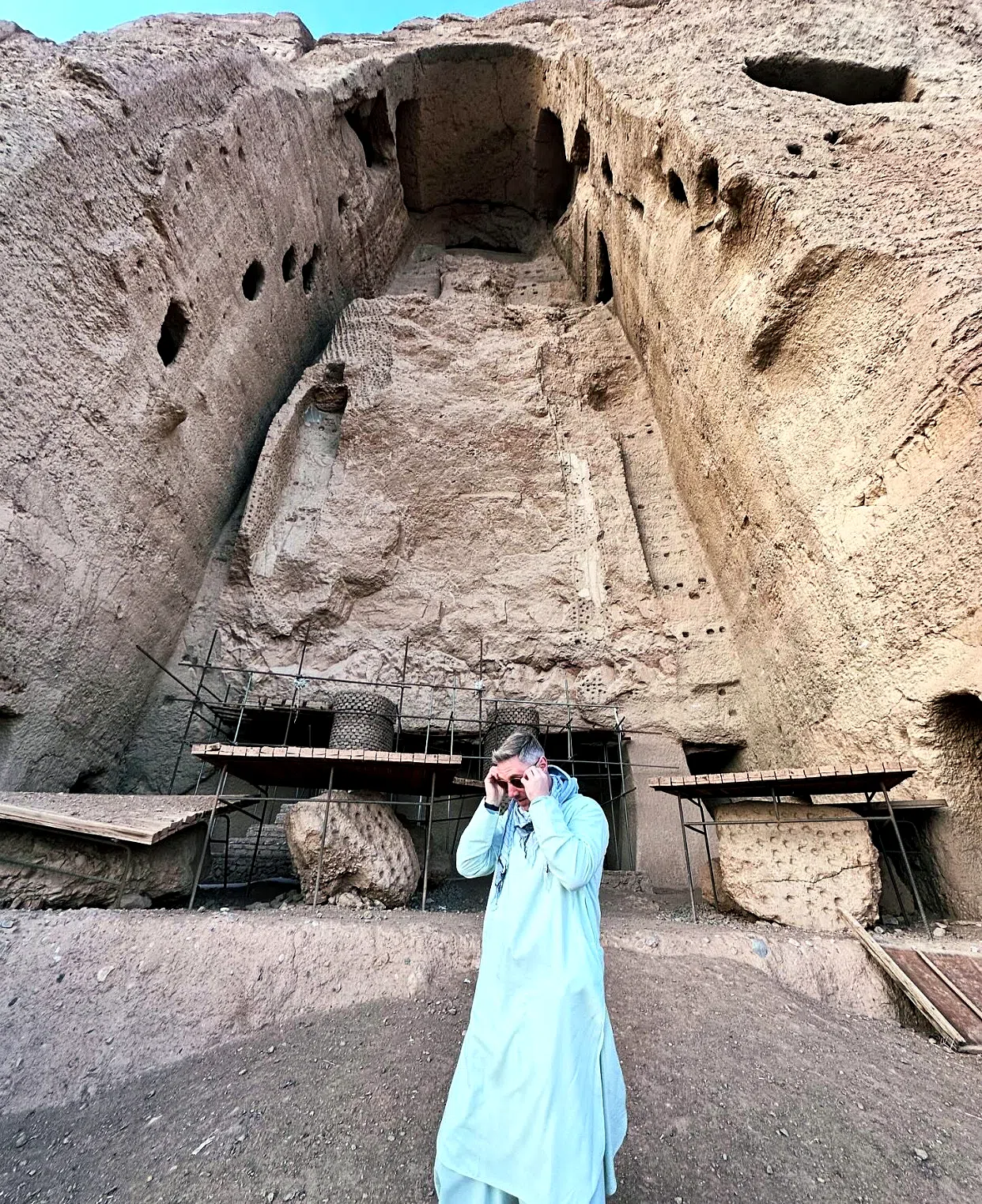 Traveler beneath the Bamyan Buddha niche