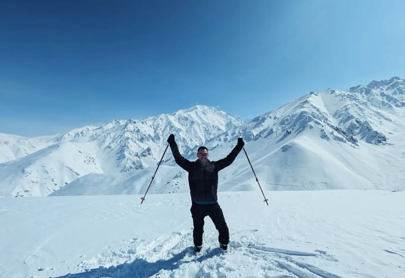 Traveler skiing in the mountains of Bamyan