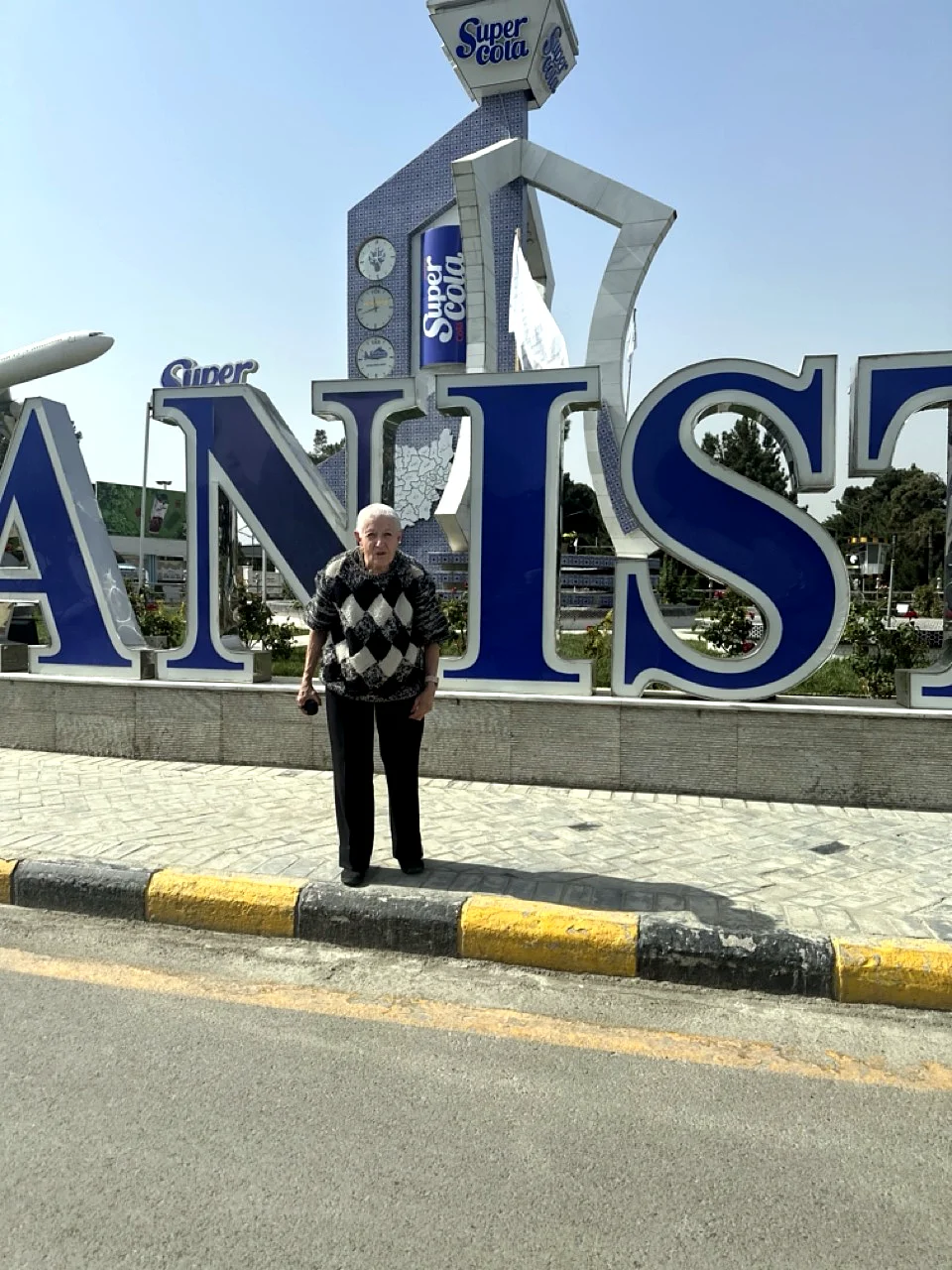 Traveler photographed at the Afghanistan sign in Kabul